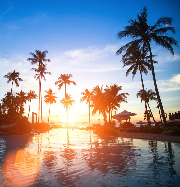 Sunset at a beach resort — Stock Photo, Image
