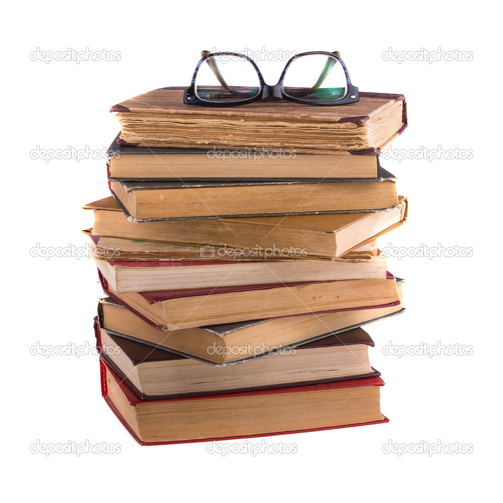 Stack of old books and spectacles