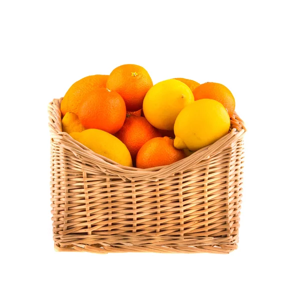 Oranges and lemons in a wooden basket — Stock Photo, Image