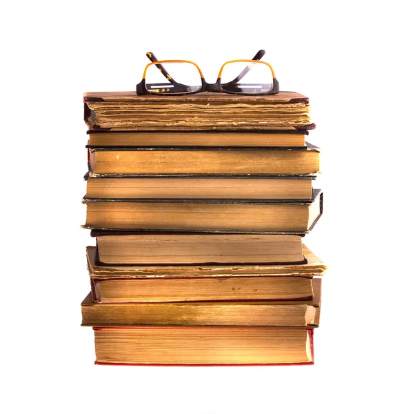 Древние книги и очки — стоковое фото