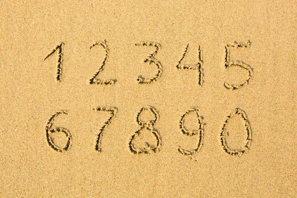 Čísla na písku — Stock fotografie