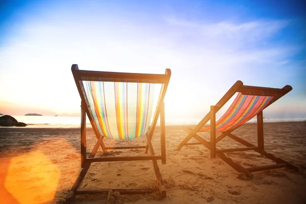 Pair of beach loungers on the deserted coast sea — Stock Photo, Image