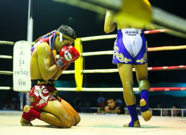 Unidentified Muay Thai fighters compete clipart