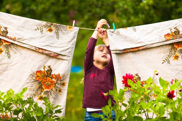 Little girl with  clothes line — Stock Photo, Image