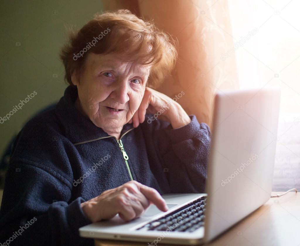 Elderly woman with laptop