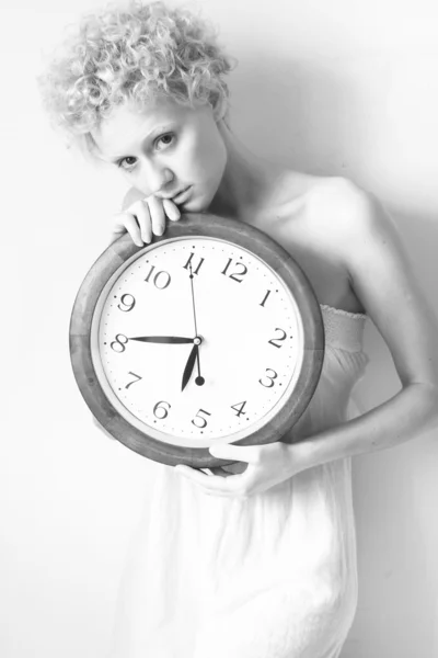 Portrait of woman with big clock — Stock Photo, Image