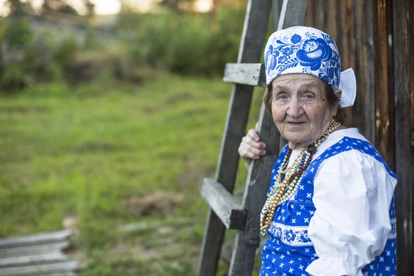 Old woman in ethnic clothes — Stock Photo, Image