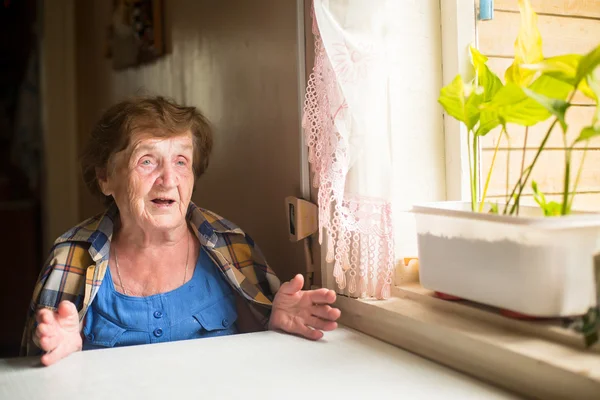Elderly woman sitting  and talk — Stock Photo, Image
