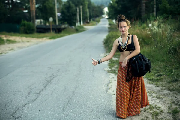 Hippie Hitchhiking Girl Stands Voting Country Road Royalty Free Stock Photos