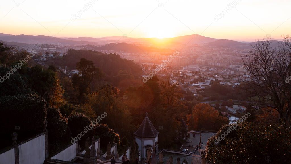View of the stairway to the church of Bom Jesus do Monte in evening golden sunset, Braga, Portugal.