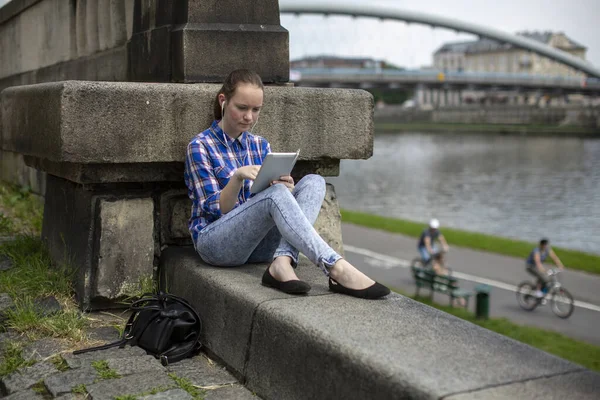 Teenage Girl Sits Tablet City Promenade Krakow Poland — Stock Photo, Image