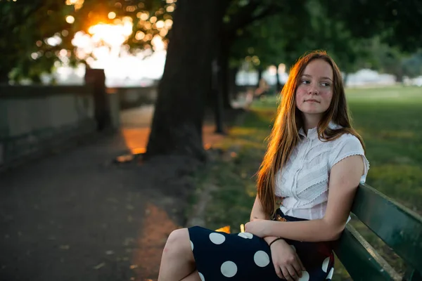 Girl Golden Hair Sits Summer City Alley Sunset — стоковое фото