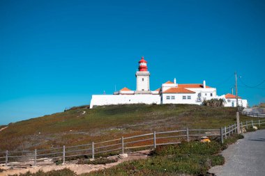 Lighthouse on portuguese Farol de Cabo da Roca near Sintra, Portugal.