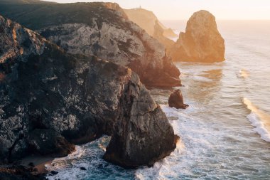 Cliffs in Miradouro da Praia do Caneiro, Atlantic Ocean, Portugal. 