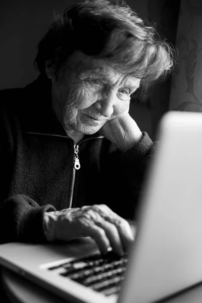 Senior Woman Working Computer Her Home Black White Photo — стоковое фото