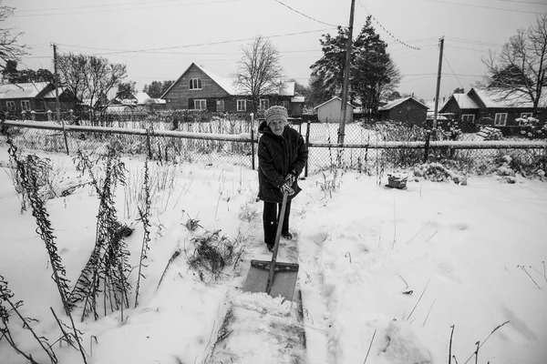 Elderly Woman Clearing Snow Village Black White Photo — Photo