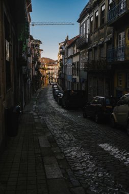 A view of the one of the narrow streets in the old town of Porto, Portugal.
