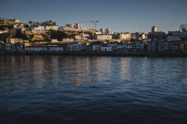 View of the Douro River and Vila Nova de Gaia banks in the center of the Porto, Portugal.