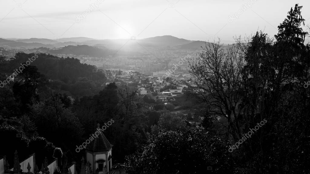 View from the church Bom Jesus do Monte stairway during amazing sunset light, Braga Portugal. Black and white photo.