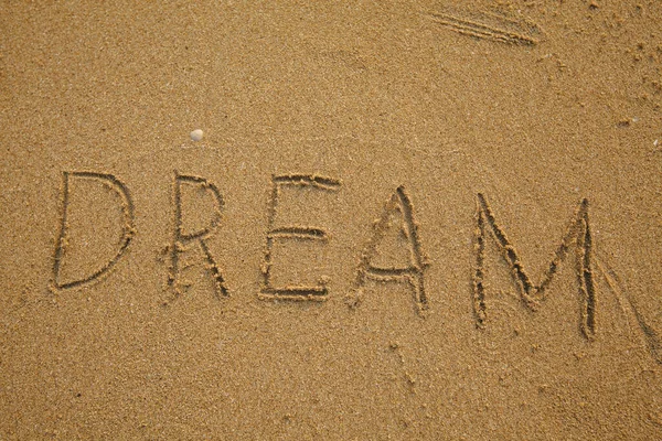 Handbeschriebener Traum Auf Der Textur Des Sand Strand Stockfoto