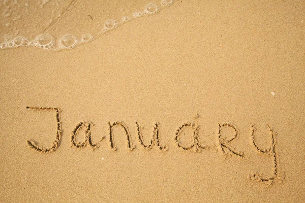 Janeiro Desenho Escrito Mão Areia Praia Mar — Fotografia de Stock