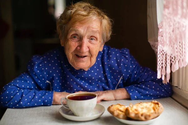 Old Woman Drinking Tea Her Village Home Stockfoto
