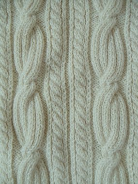 yakın çekim. kesintisiz beyaz yün el yapımı kumaş örme.