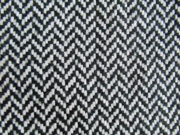 yakın çekim. sorunsuz bir siyah-beyaz geometrik desen ile doğal yün kumaş.