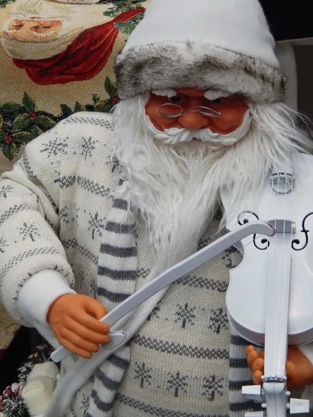 Un juguete Santa Claus con un violin.Juguetes de Navidad . — Foto de Stock