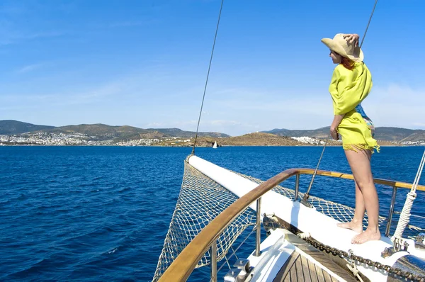 Woman on bowsprit Stock Photo