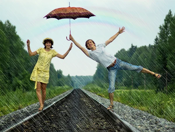 Couple under rain Stock Photo