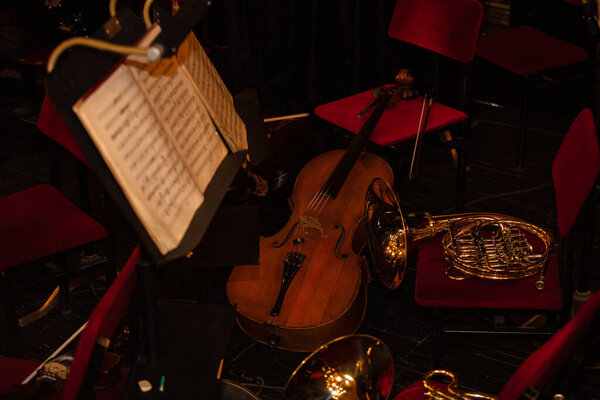 Cello and  French Horn on chair during interval  in theatre