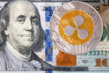 Dalgalanan para, XRP jetonu, ABD 'de şifreli para tasarım amaçlı arkaplan 100 dolar.