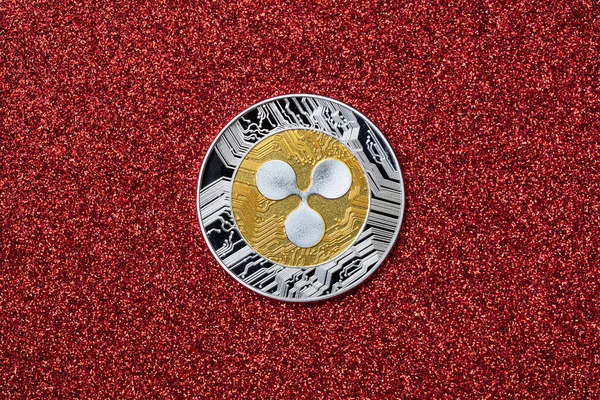 Dalgalı para, XRP jetonu, kırmızı arkaplanda kripto para birimi