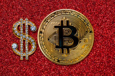 golden dollar sign with gemstones and bitcoin on red glitter background for design purpose