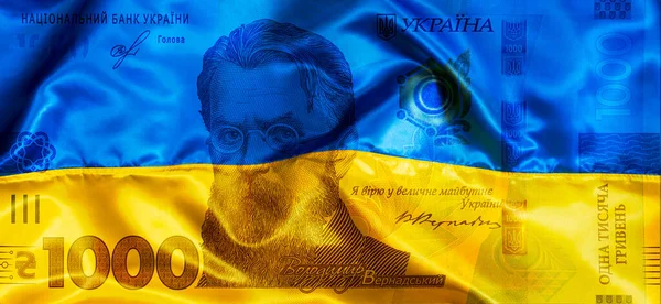 为设计目的 在乌克兰国旗背景上印有透明的1 000格里夫尼亚钞票 — 图库照片