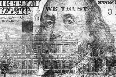 100 dolarlık banknotun bir parçası. Tasarım amacı için banknotun görünür detayları ters çevrilmiş.