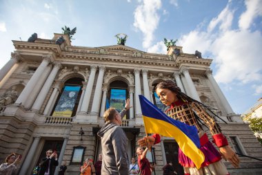 Lviv, Ukraine - May 11, 2022: Little Amal, a giant puppet representing a Syrian refugee girl, in Lviv, Ukraine