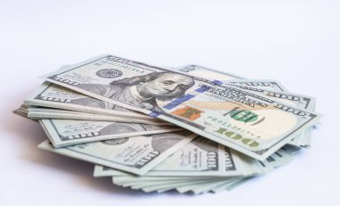 Pile of 100 dollar banknotes on white background for design purpose