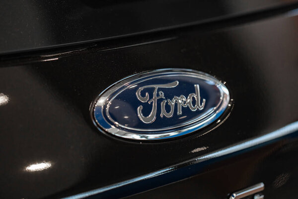 Lviv, Ukraine - October 17, 2022: Closeup of Ford logo on black car