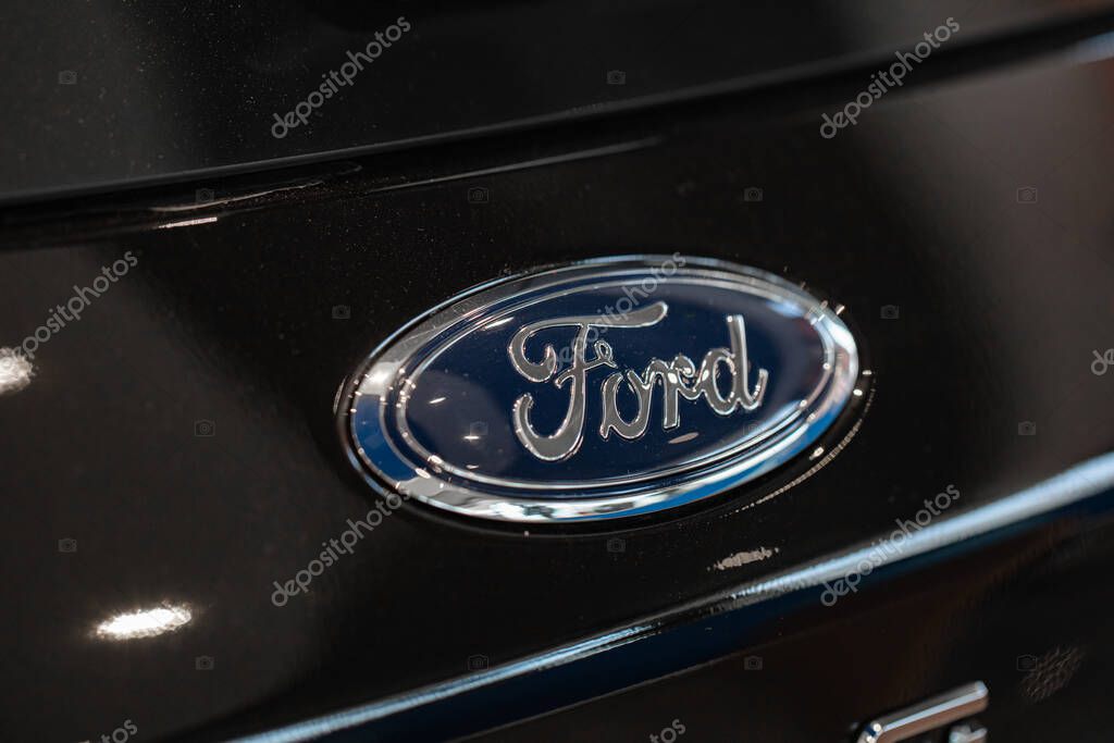 Lviv, Ukraine - October 17, 2022: Closeup of Ford logo on black car