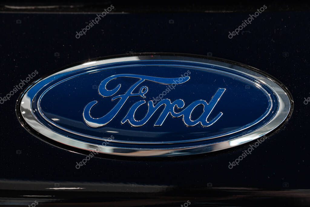 Lviv, Ukraine - October 17, 2022: Closeup of Ford logo on black car