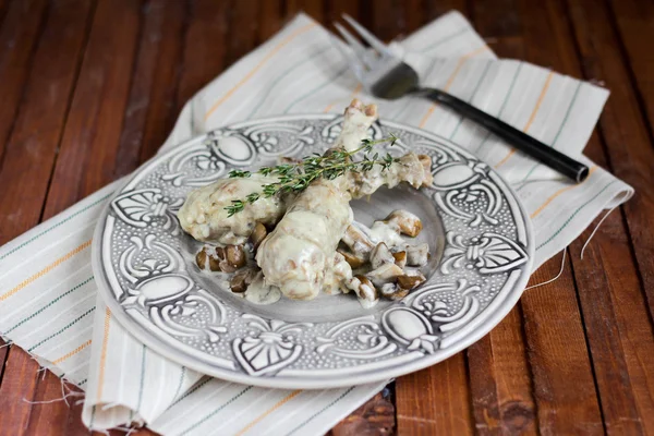 Guinea fowl with mushrooms Royalty Free Stock Photos