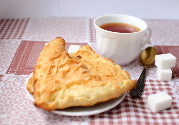 Rollos con té para desayunar Imagen de stock