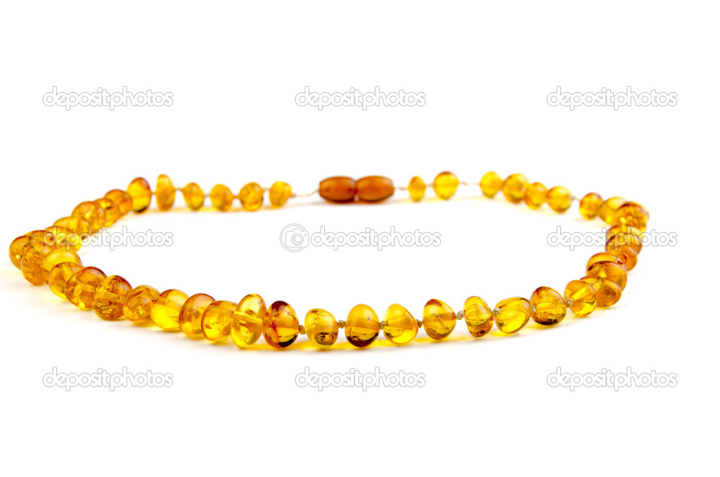 Closeup of an amber necklace on white background