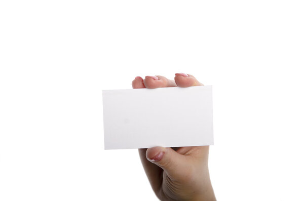 Close-up of an empty business card in a woman's hand isolated on white