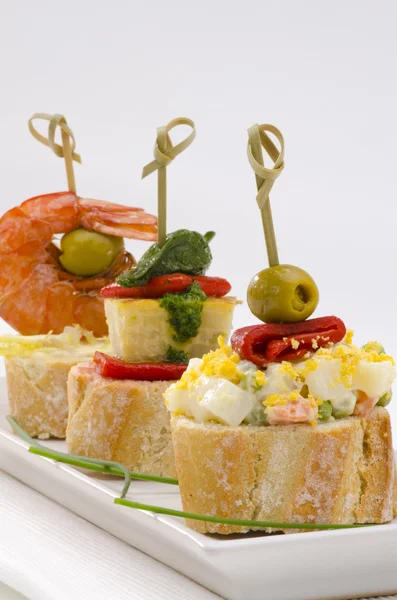 Spanish Cuisine. Tapas. Tray of montaditos. — Stock Photo, Image