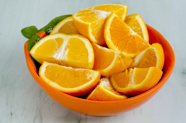 Sliced oranges in a bowl — Stock Photo, Image
