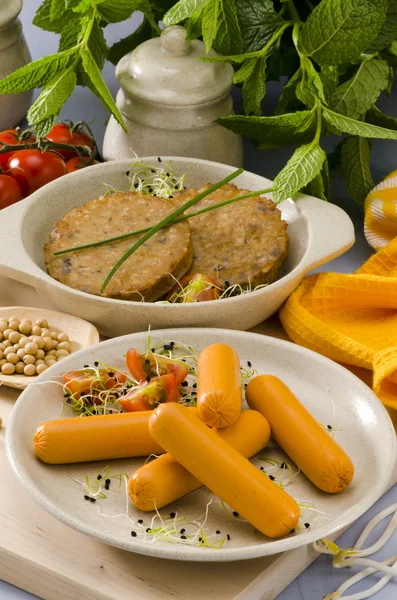 Vegetarian tofu burger and tofu sausage. — Stock Photo, Image