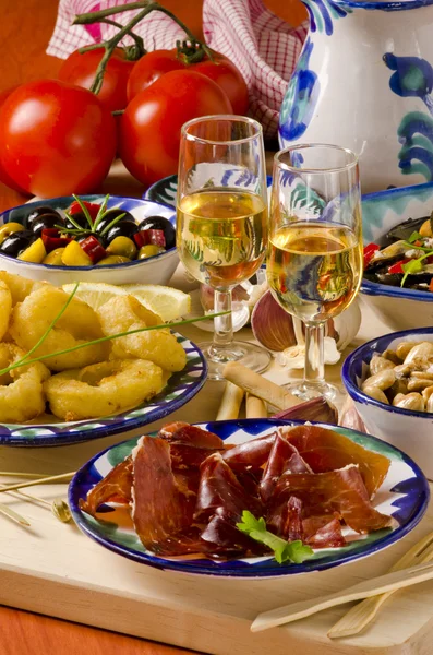 Spanish Cuisine. Assorted tapas on ceramic plates. — Stock Photo, Image